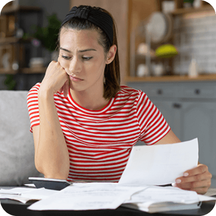 Woman looking at utility bills
