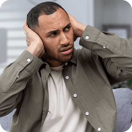 Man closing his ears